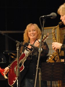 Suzanne Smiling w/guitar